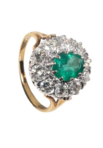 Dated 1976 - Entourage ring with emerald and diamonds
